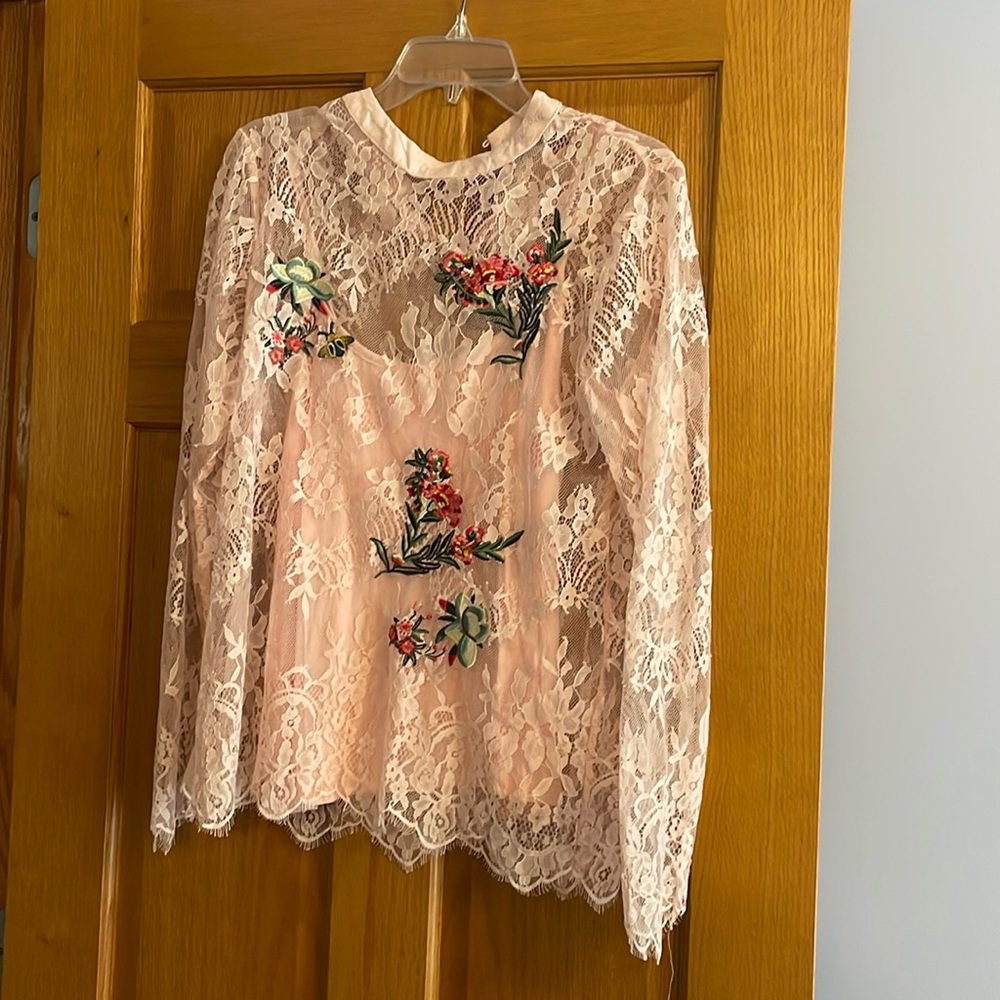 Women’s pink lace top with embroidered flowers